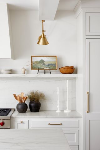 a white inset kitchen with accessories