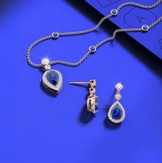 Blue Angara gemstone jewellery on a cobalt blue background