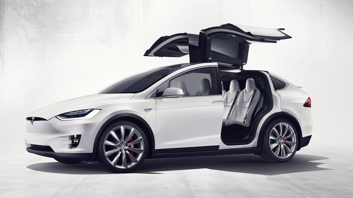 Tesla unveils its Model X SUV complete with falcon wing doors and 'bio