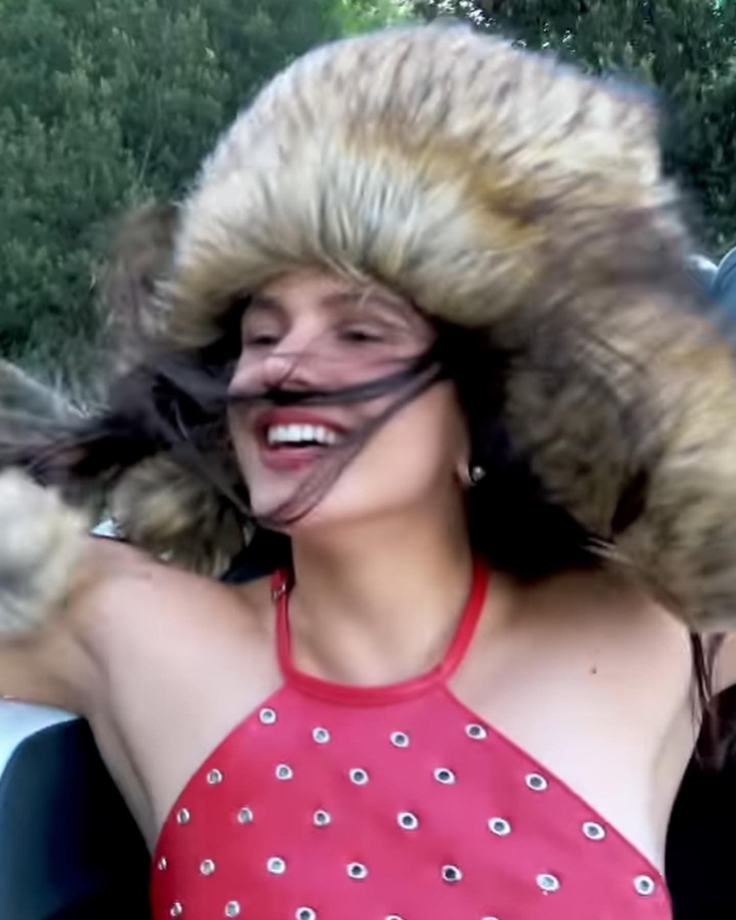 Rosalía wearing a custom studded Gimaguas top.