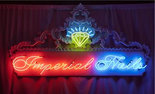 Light up wall sign saying "imperial nails"