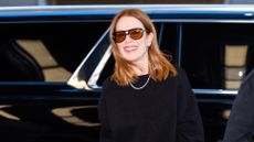 a headshot of julianne moore wearing sunglasses