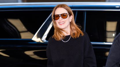 a headshot of julianne moore wearing sunglasses