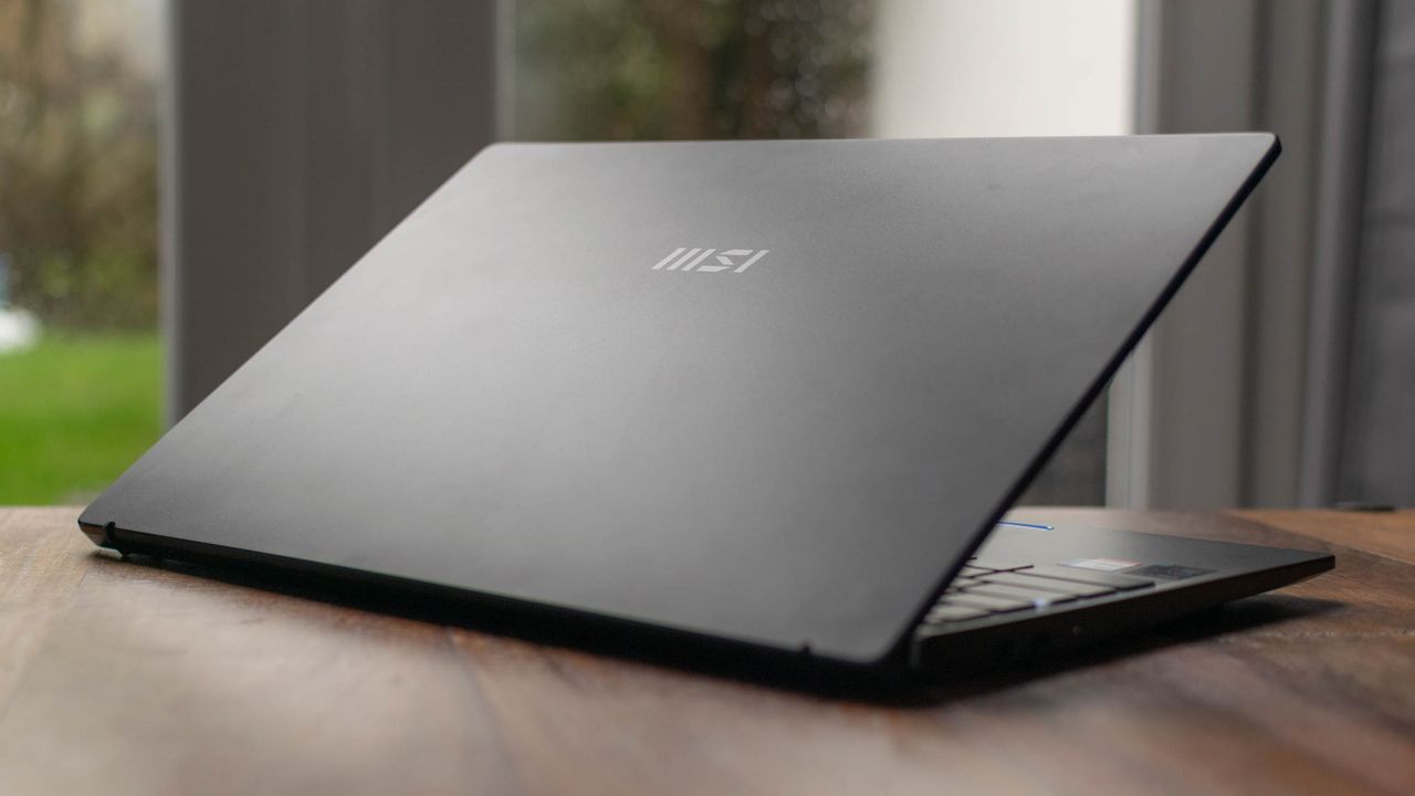 A photograph of the MSI Prestige 14 Evo on a table from behind