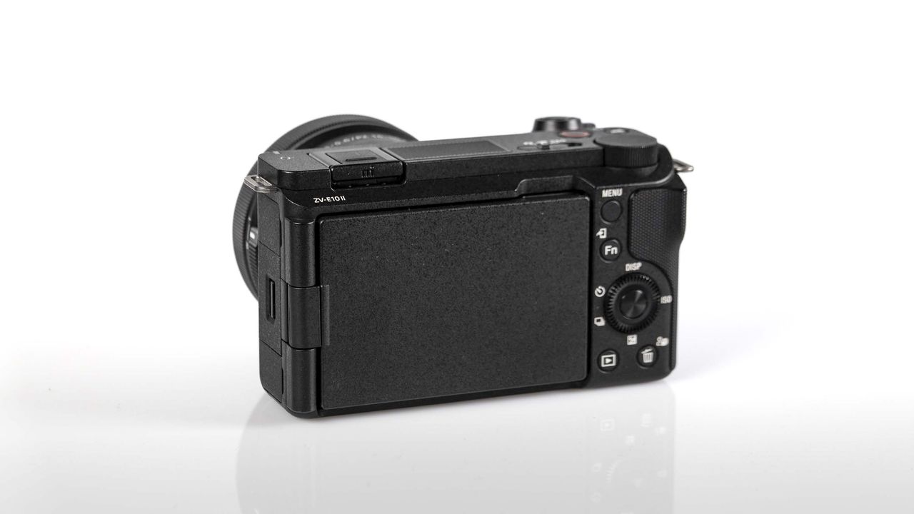 Sony ZV-E10 II on reflective surface and white background