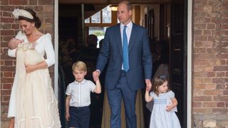 Kate Middleton holding Prince Louis at his christening, joined by Prince William, George and Charlotte