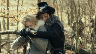 queen christina of sweden and Countess Ebba Sparre shoot a gun in the woods in the movie the girl king