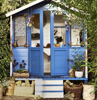 Blue painted shed and decking