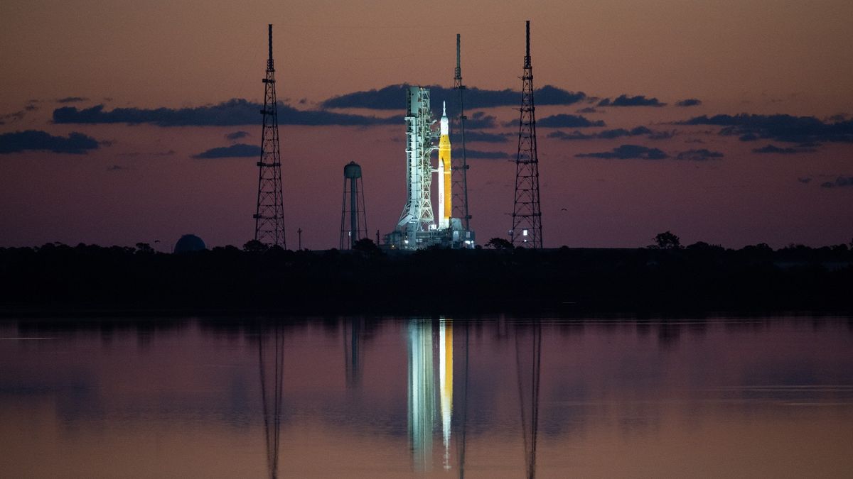 illuminated rocket on launch pad