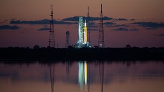 NASA’s Space Launch System (SLS) rocket with the Orion spacecraft aboard is seen at sunrise atop a mobile launcher at Launch Complex 39B, Monday, April 4, 2022.
