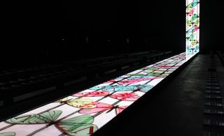 An elongated screen became a catwalk for the Louis Vuitton show