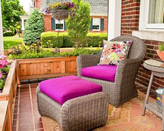 porch with rattan chair and planters
