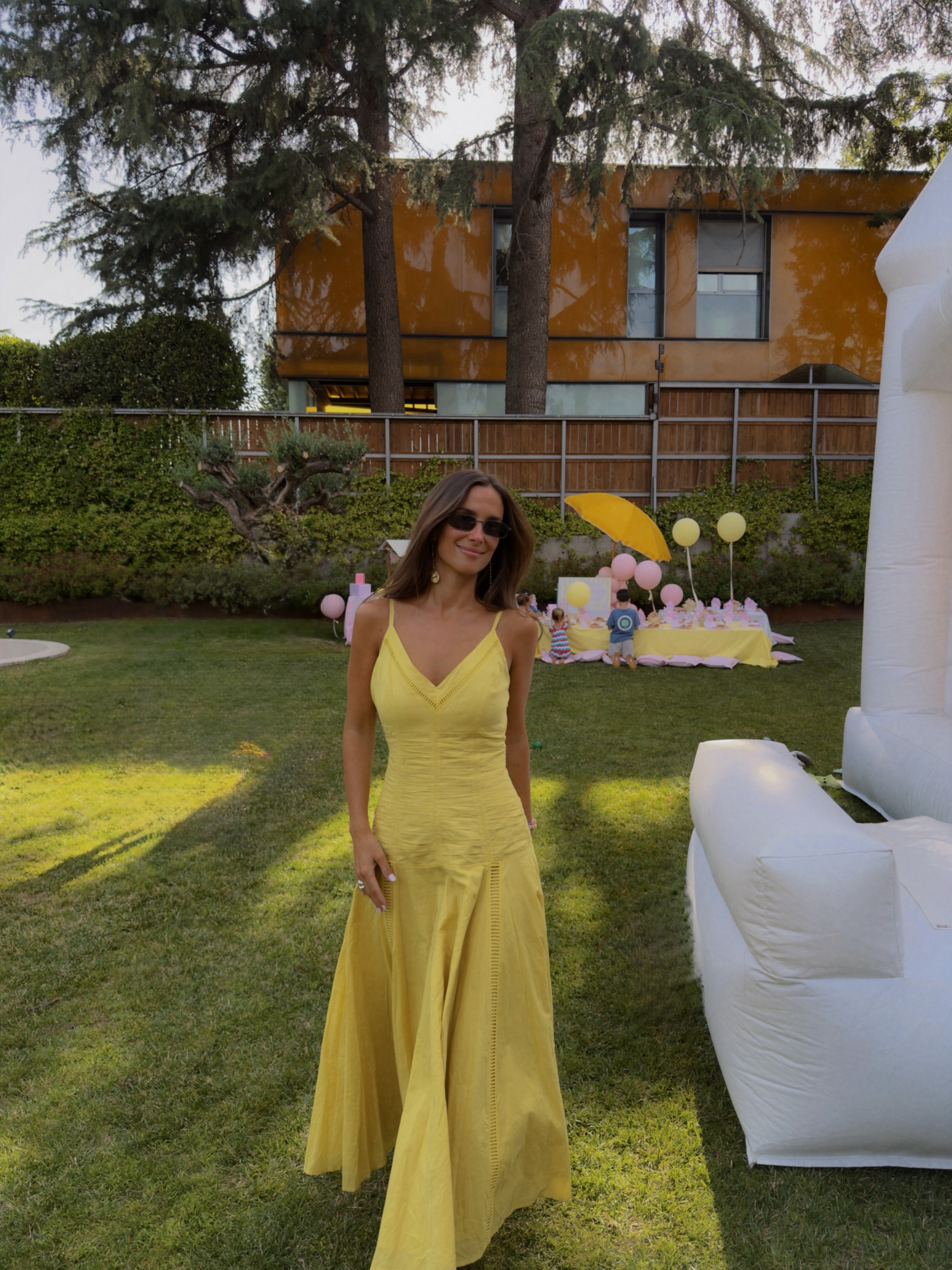 Spanish woman wearing sunshine yellow, a summer 2026 trend.