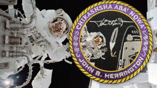 an astronaut floats in space in a spacesuit. an inset image shows a patch depicting a feather beside the space shuttle