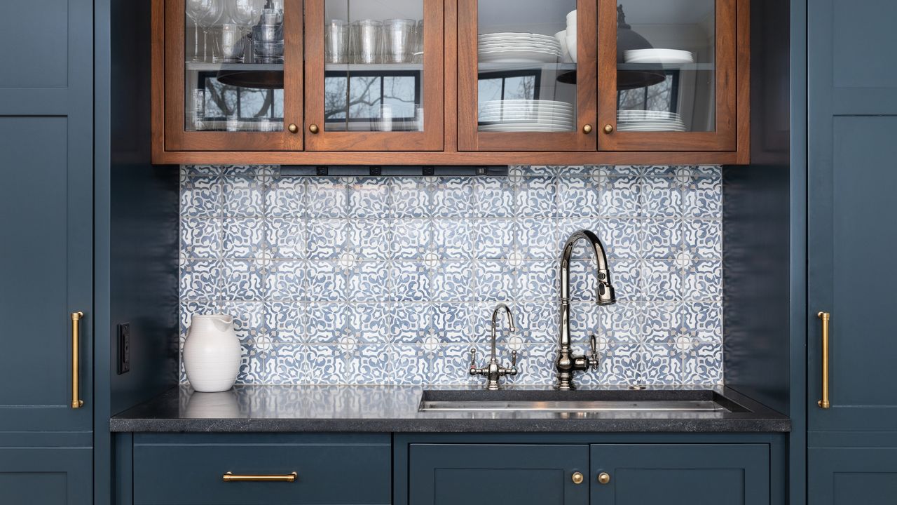 Blue kitchen cabinets with sink