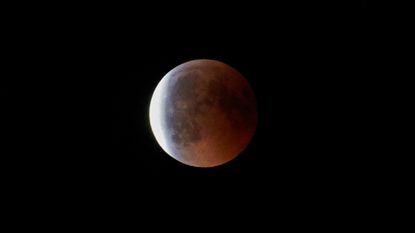 lunar eclipse against a black sky