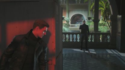 Bond peeks around a corner at a guard in 007 First Light