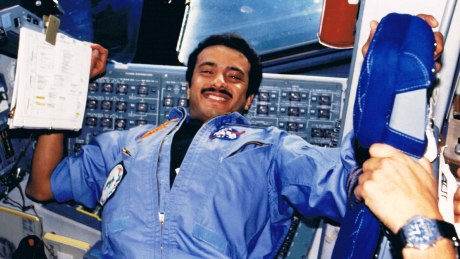 Saudi astronaut Sultan Salman Abdelize Al-Saud, a Saudi prince, logs notes while floating in the middeck of space shuttle discovery during the STS-51G mission to deploy the Arabsat-1B communications satellite in June 1985.