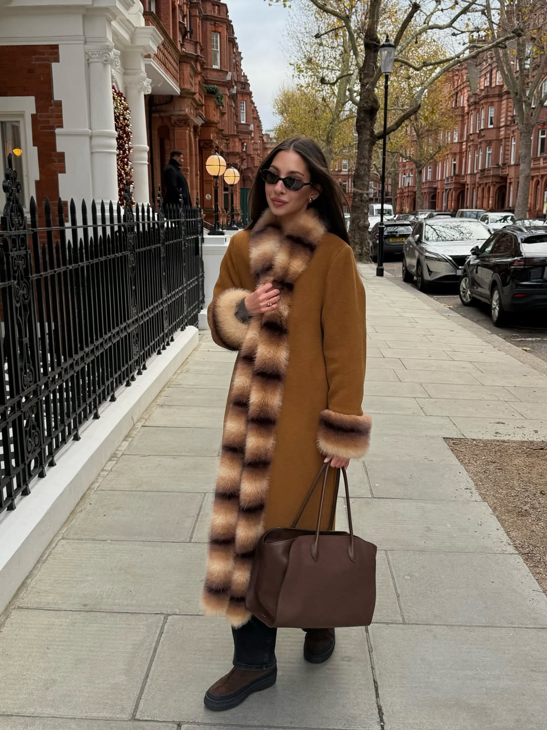 Felicia Akerstrom wearing a fur-lined coat from Malina.