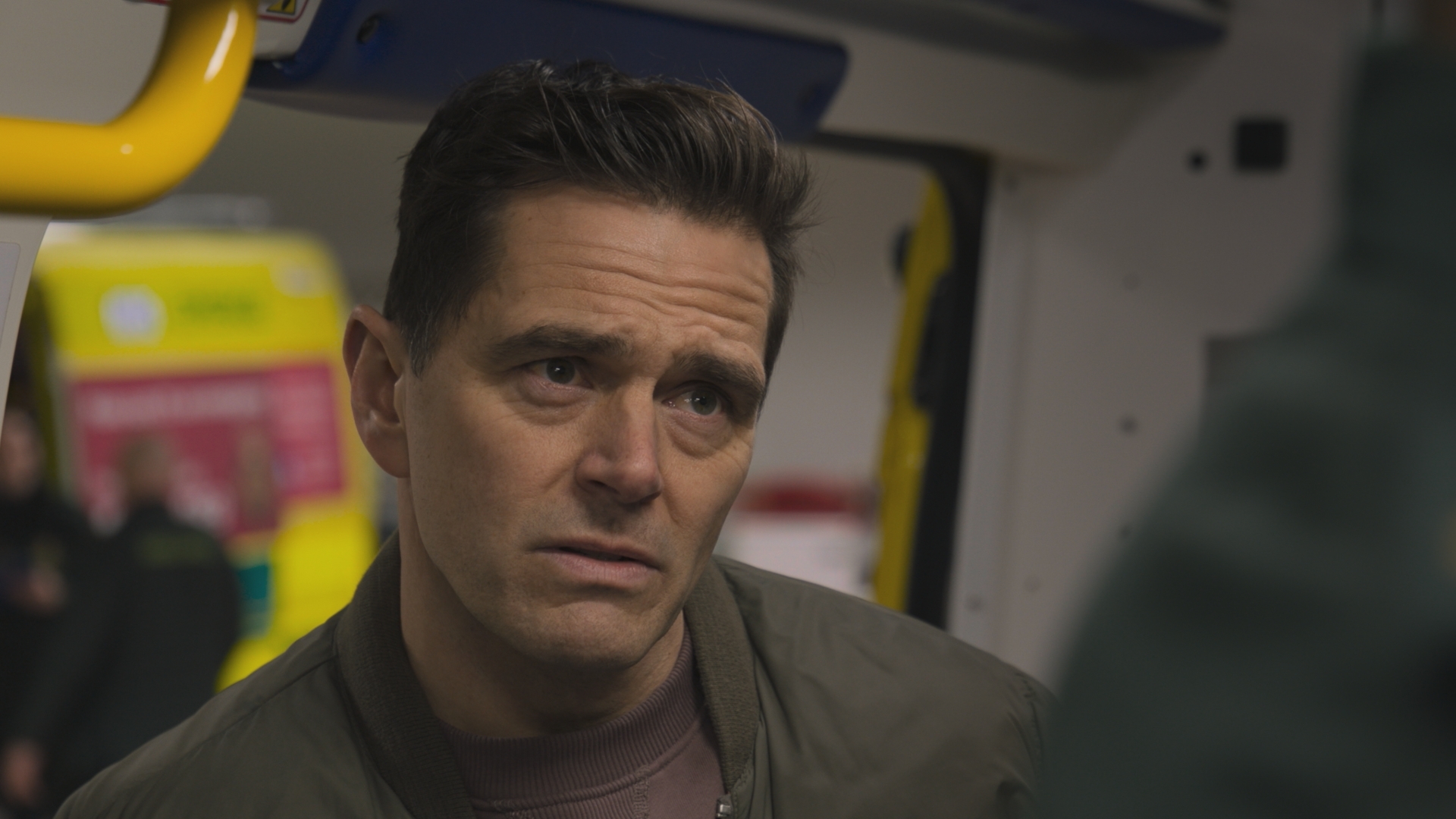 Iain Dean confronts Jacob Masters in the back of an ambulance.