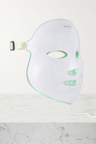 Unicskin Unicled Korean Mask sitting on a white marble countertop with a light gray background 
