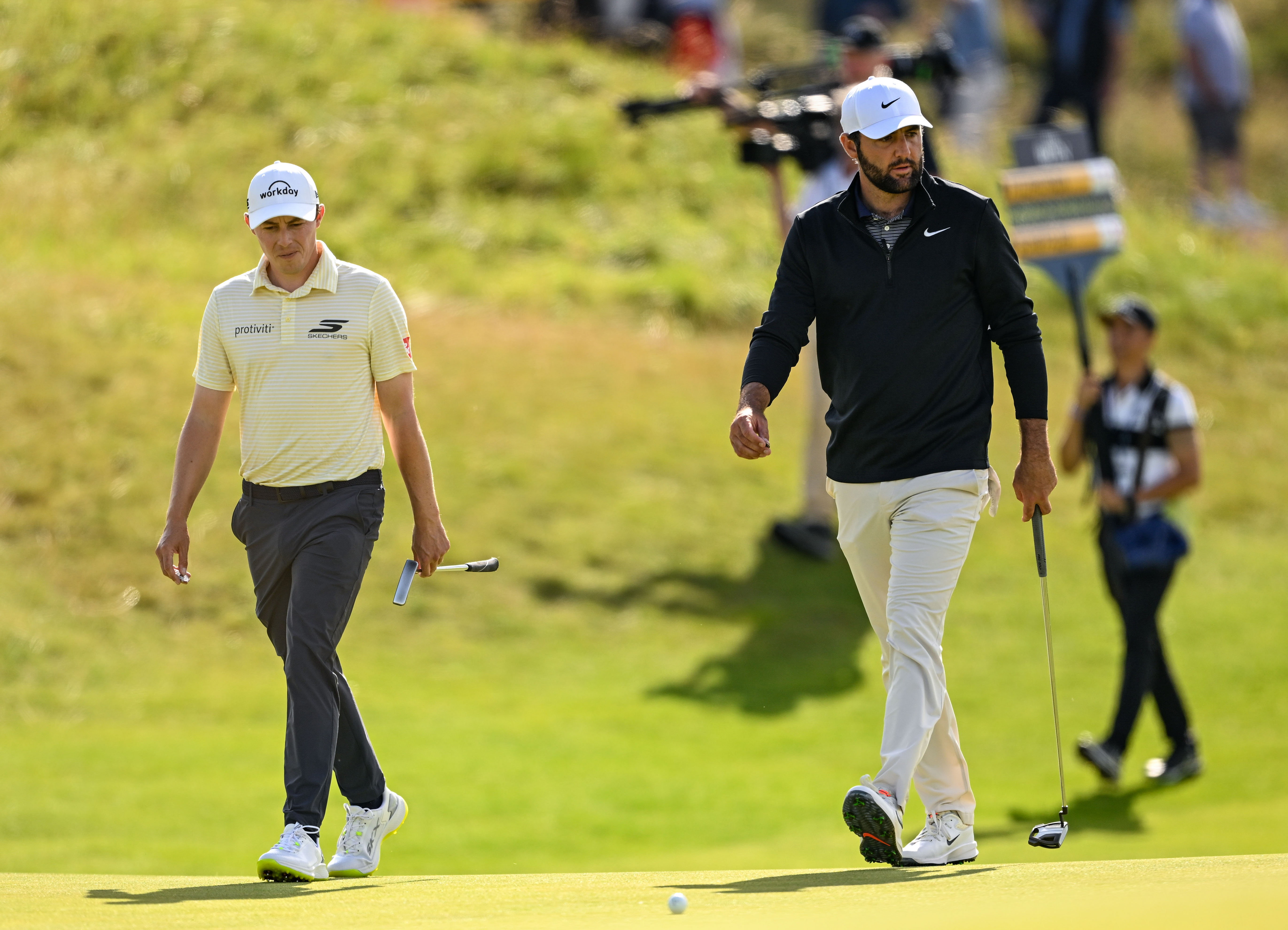 Matt Fitzpatrick and Scottie Scheffler walk onto the eighth green during day three of The 153rd Open Championship at Royal Portrush Golf Club