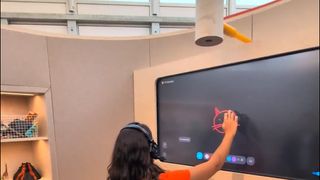 Project Astra demonstration room at Google I/O showing large display and toys