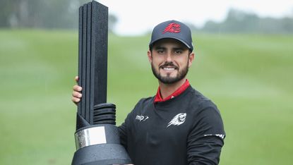 Abraham Ancer poses with the 2024 LIV Golf Hong Kong trophy
