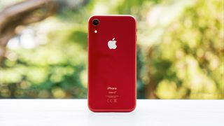 An iPhone XR from the back, in red