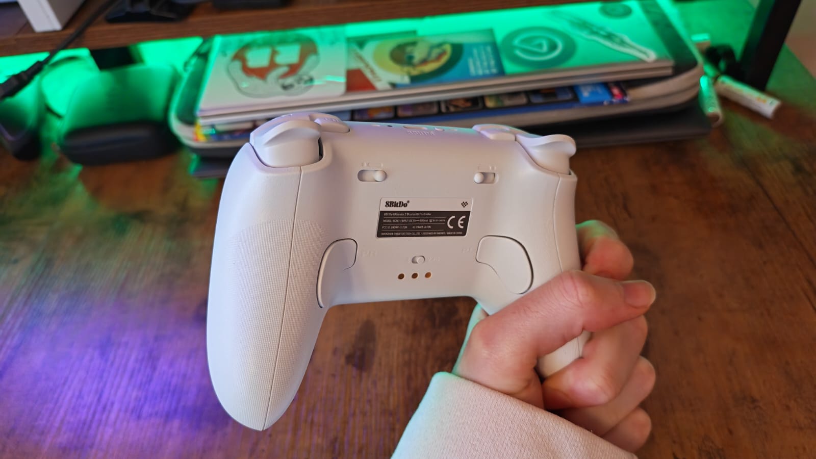 The back of the 8BitDo Ultimate 2 controller, shown by a reviewer