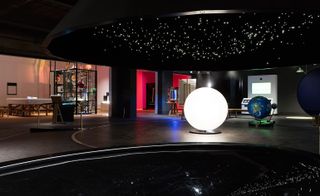 A rotating solar system, which can be ridden by visitors, is a central focus of the Wonderlab