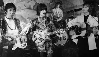 The Beatles perform on the stage of the Saville Theatre in London
