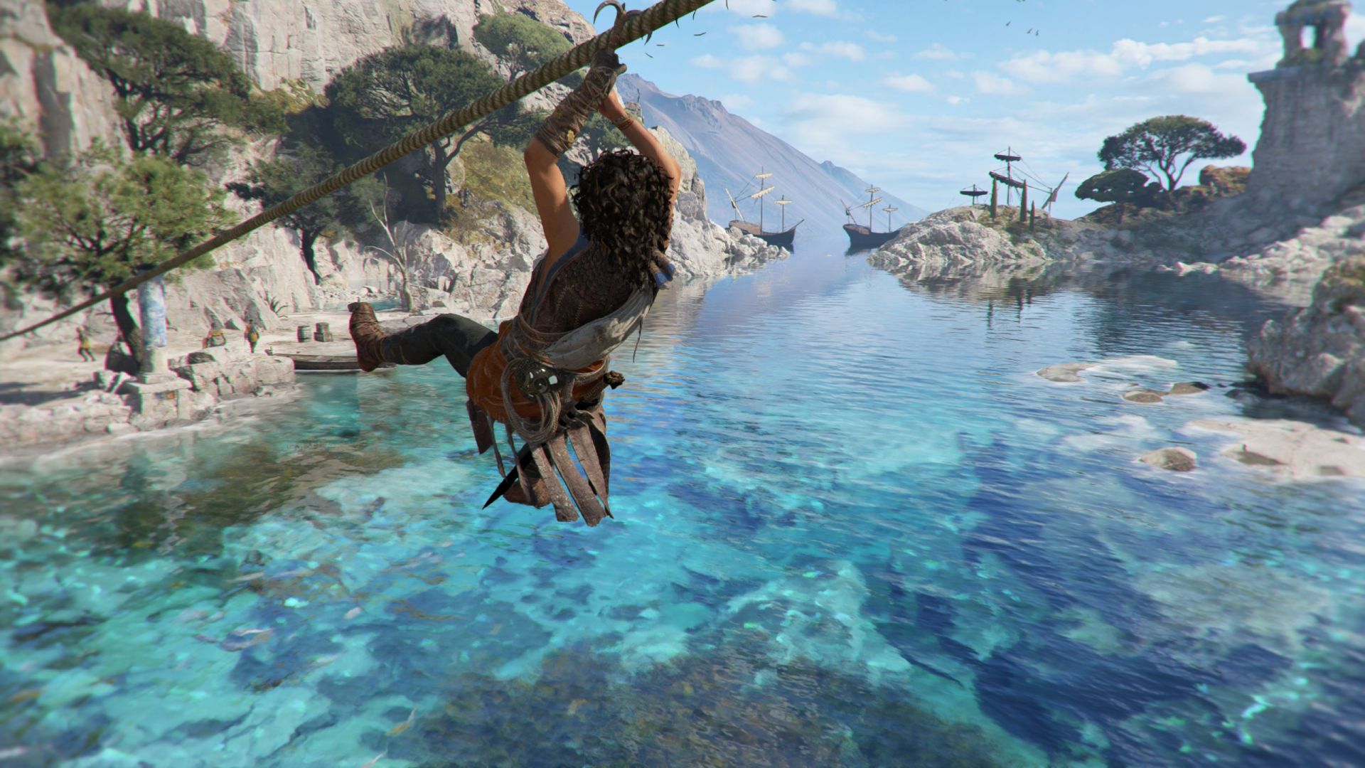 Sophia ziplines over tropical water