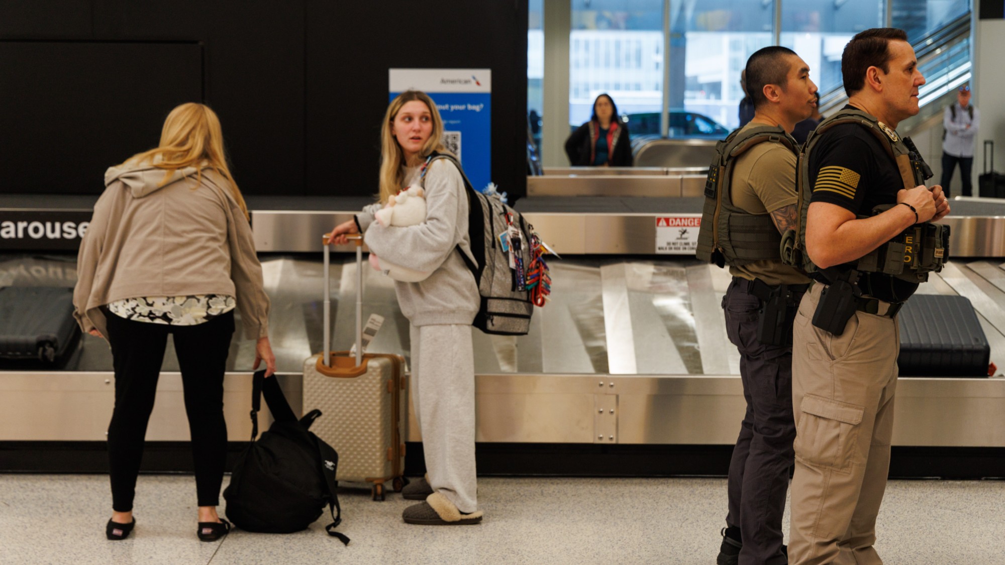 Immigration agents and travelers are seen inside Newark Liberty International Airport's Terminal A in Newark, New Jersey, on March 23, 2026. President Donald Trump states that Immigration and Customs Enforcement (ICE) will be deployed to airports nationwide beginning Monday. The agents are expected to assist TSA officers with security. (Photo by Matthew Hoen/NurPhoto via Getty Images)