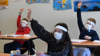 French schoolchildren wearing protective masks 