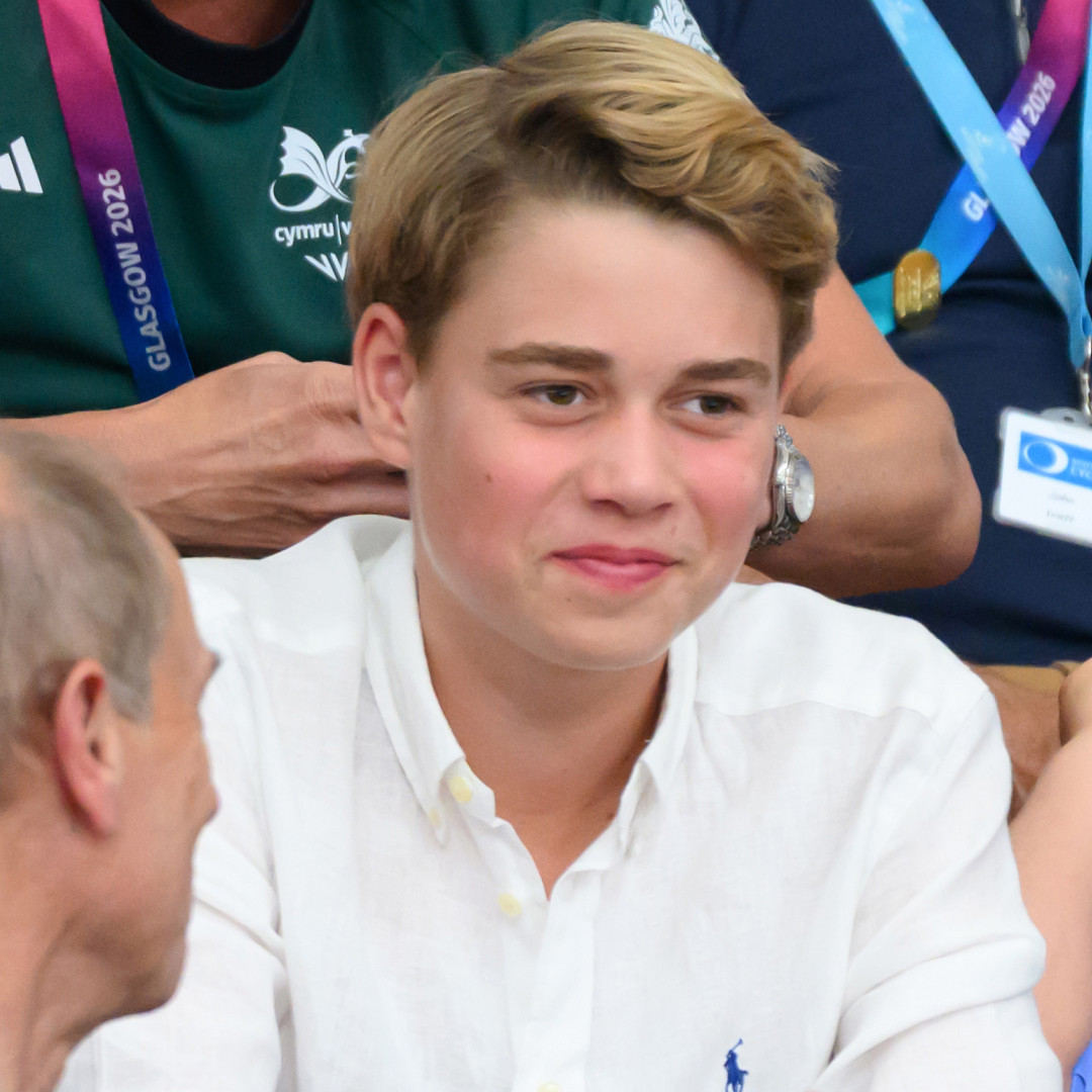 Prince George smiling in a white shirt