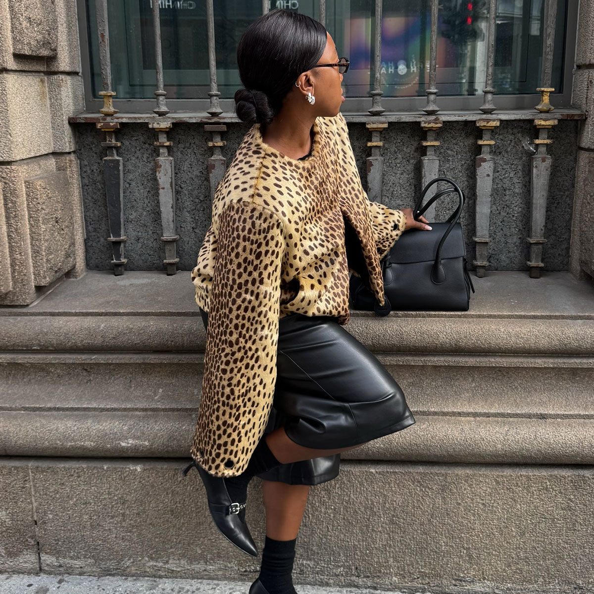 @nnennaechem outfit photo animal print jacket and black boots 