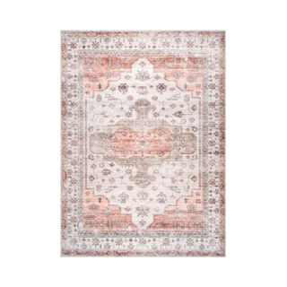 A pink medallion style rug
