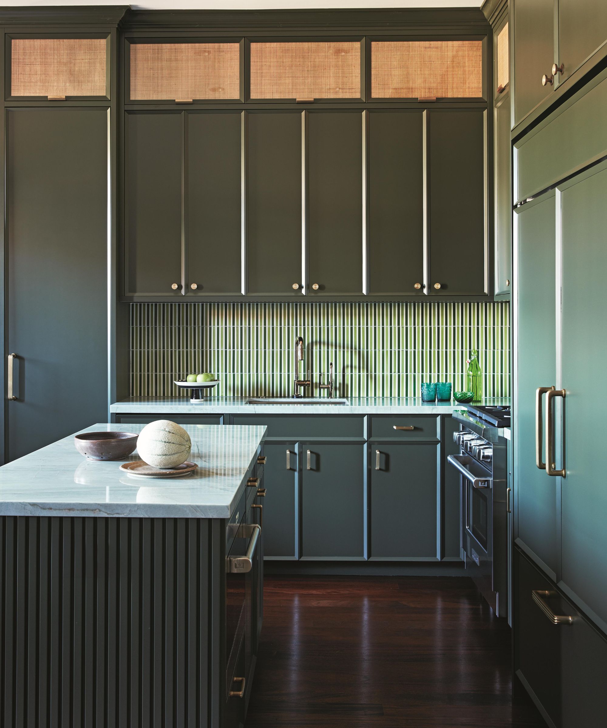 a green modern kitchen in a new york apartment