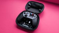 Honeycomb Aeornautical Echo Aviation Controller with a magenta cardstock background highlighting its open carry case with accessories