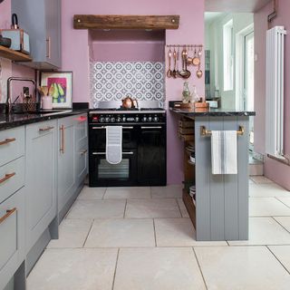 kitchen with tiles flooring and grey cabinets