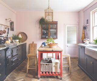 Black cabinets, red stand, pink walls