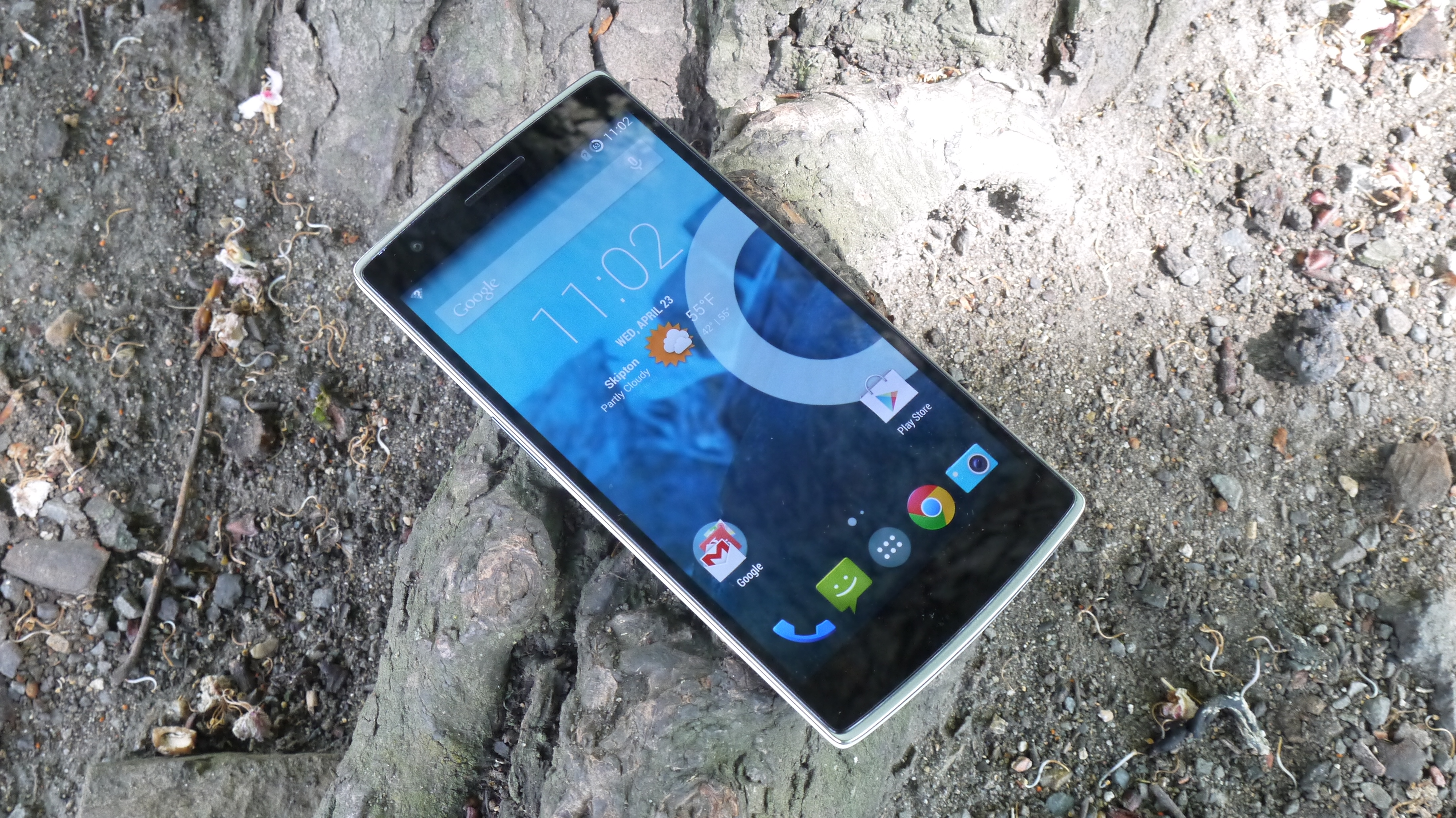 The OnePlus One resting on a rock