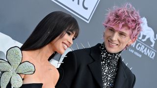 Fox and MGK smiling at the 2022 Billboard Awards