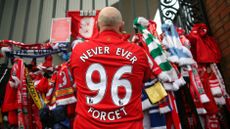 Liverpool fans pay their respects at the Hillsborough memorial at Anfield