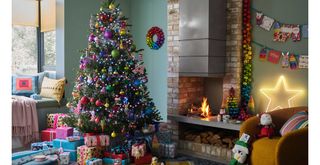rainbow coloured Christmas tree theme in a teal living room