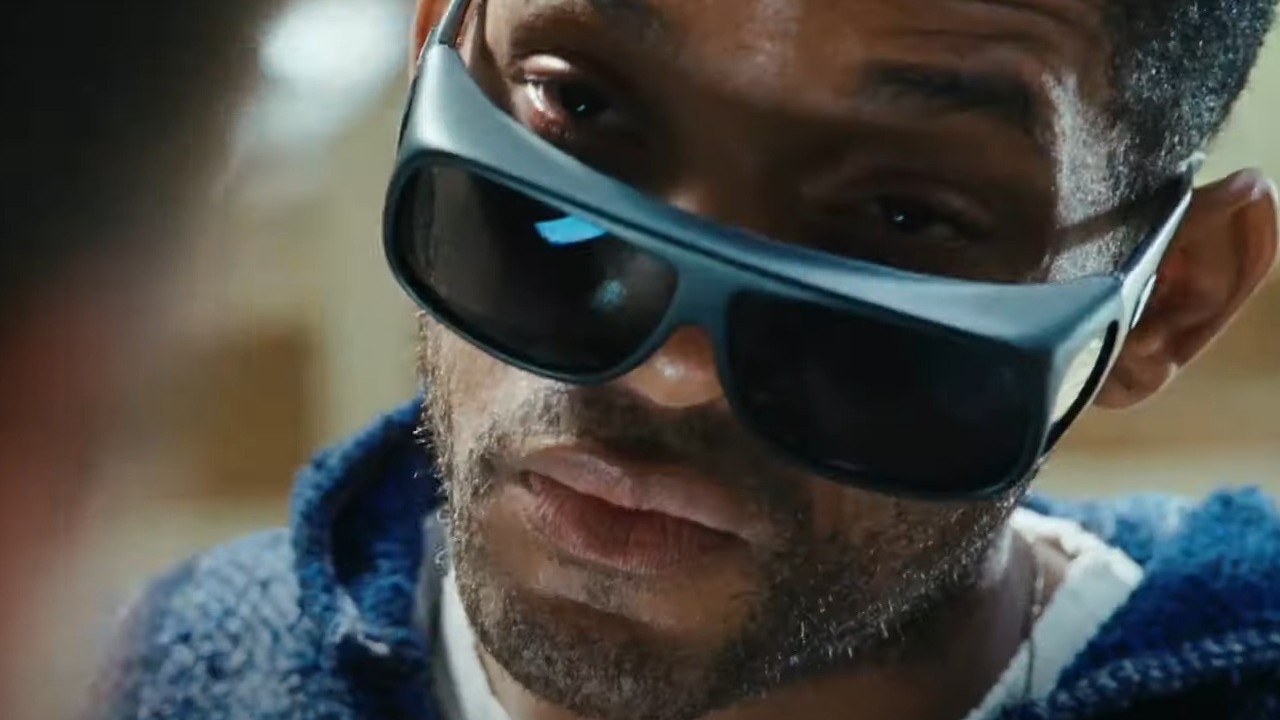 Will Smith lowering his sunglasses in Hancock