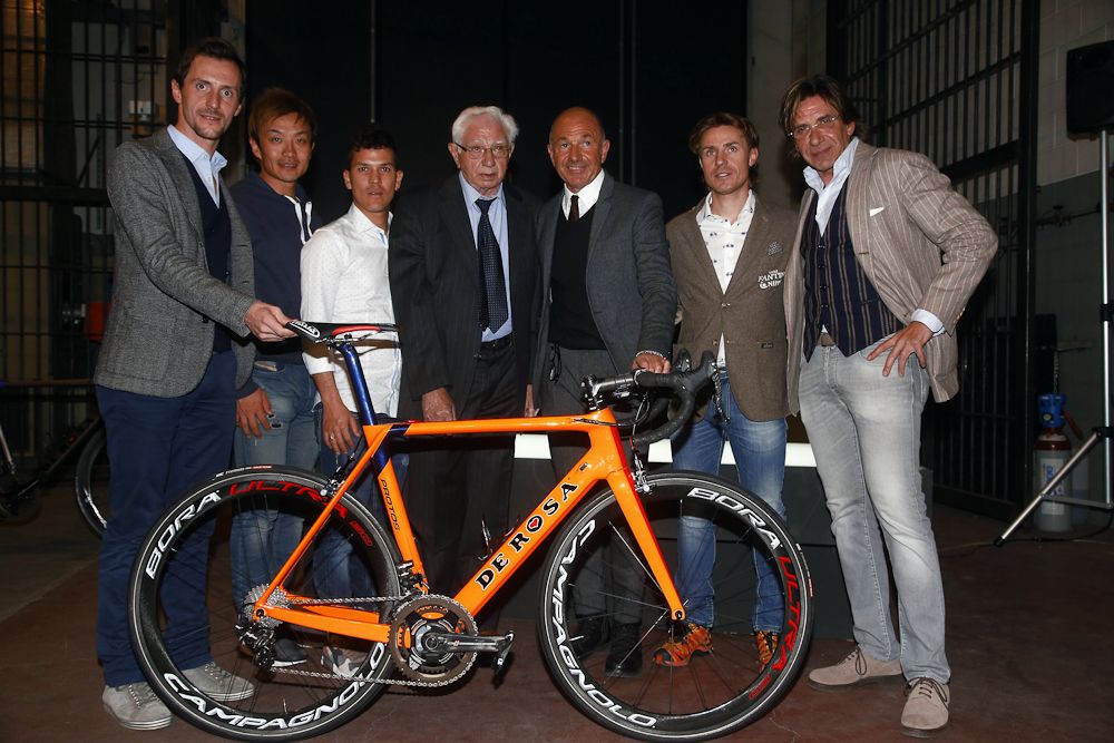 Nippo - Vini Fantini riders stand wirh Ugo De Rosa behind one of the 2017 team bikes.