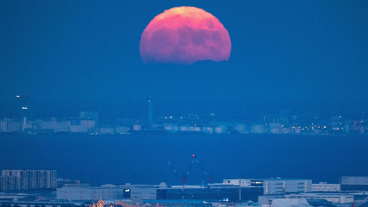 The full moon is seen from the observation deck of Roppongi Hills Mori Tower, during a harvest-moon viewing event in Tokyo on September 10, 2022.