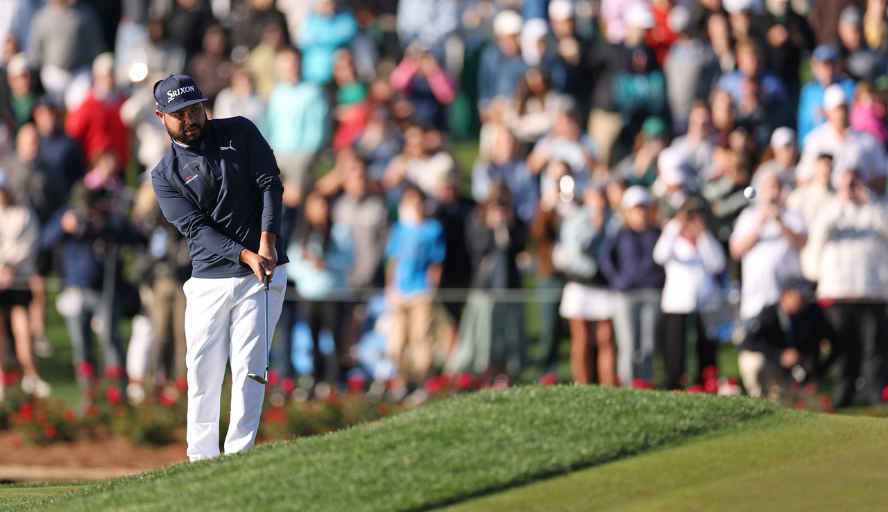 JJ Spaun hits a chip shot at The Players Championship